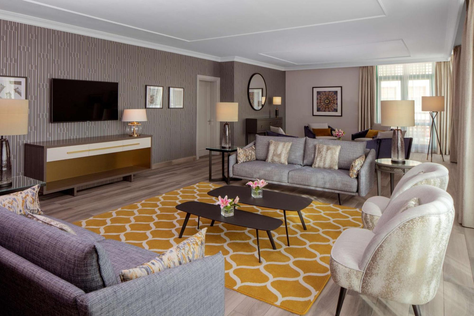 Grand Hyatt Amman Hotel Kültér fotó The living room of a suite at The Westin Palace, Madrid